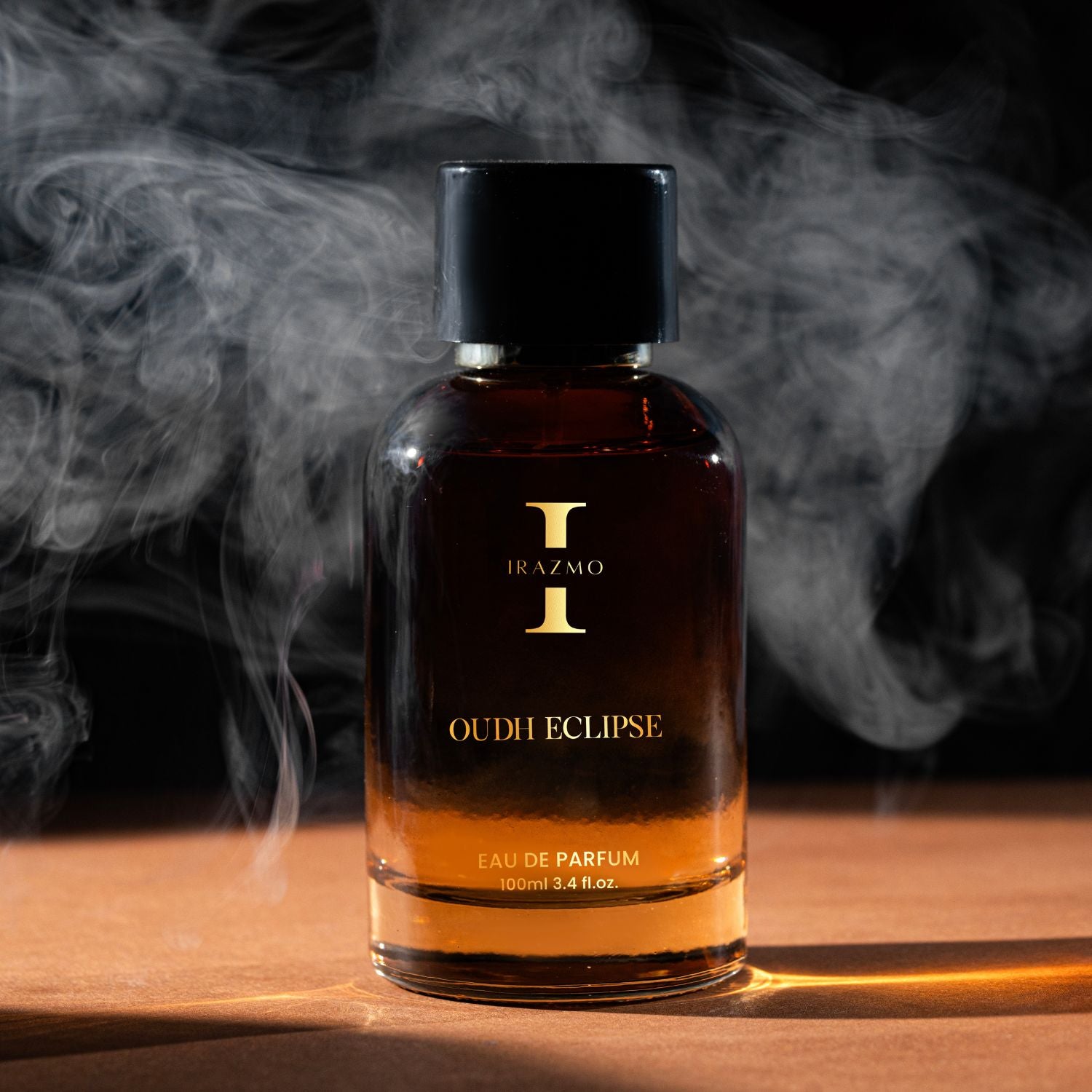 Bottle of Iraizmo Oudh Eclipse perfume with smoke in the background