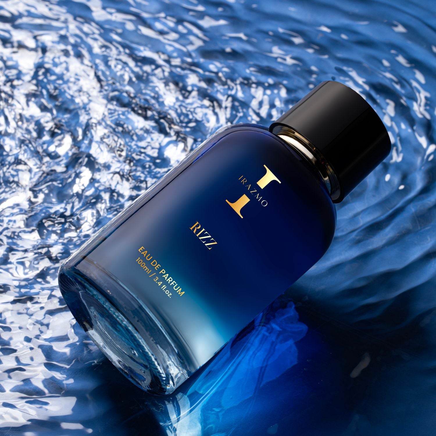 Blue perfume bottle with black cap on water