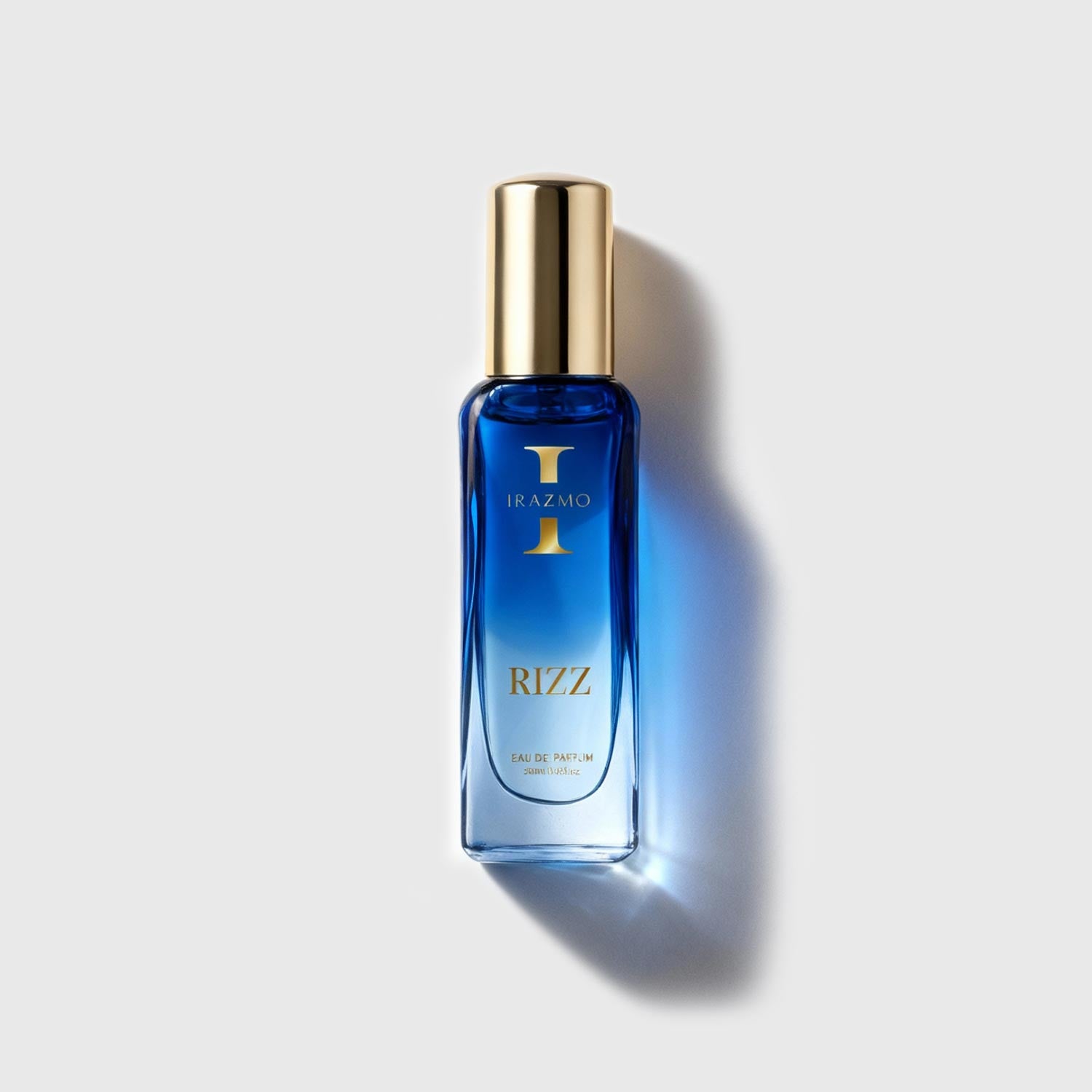 Blue perfume bottle with gold cap on a light gray background