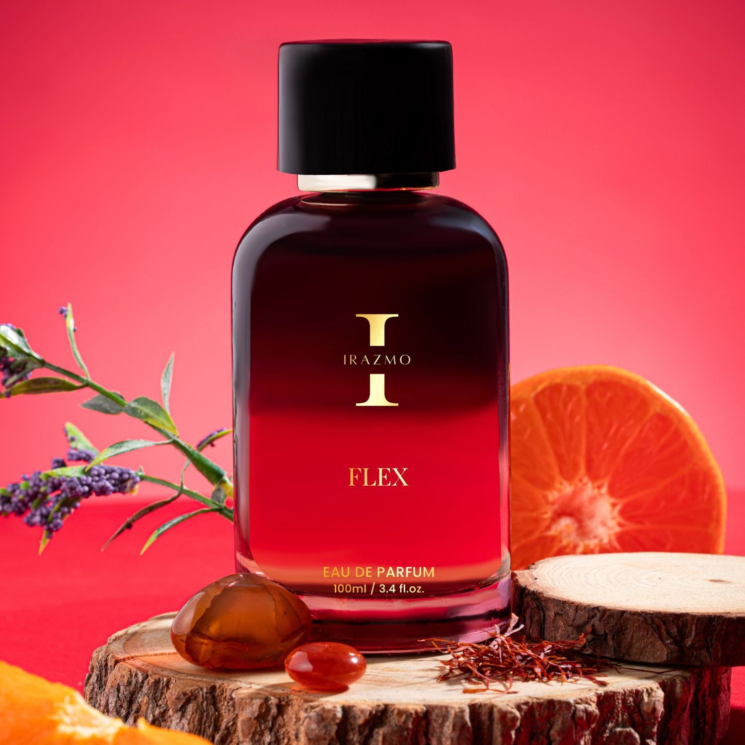 Red perfume bottle labeled 'Irazmo Flex' on a wooden platform with fruits and flowers against a red background