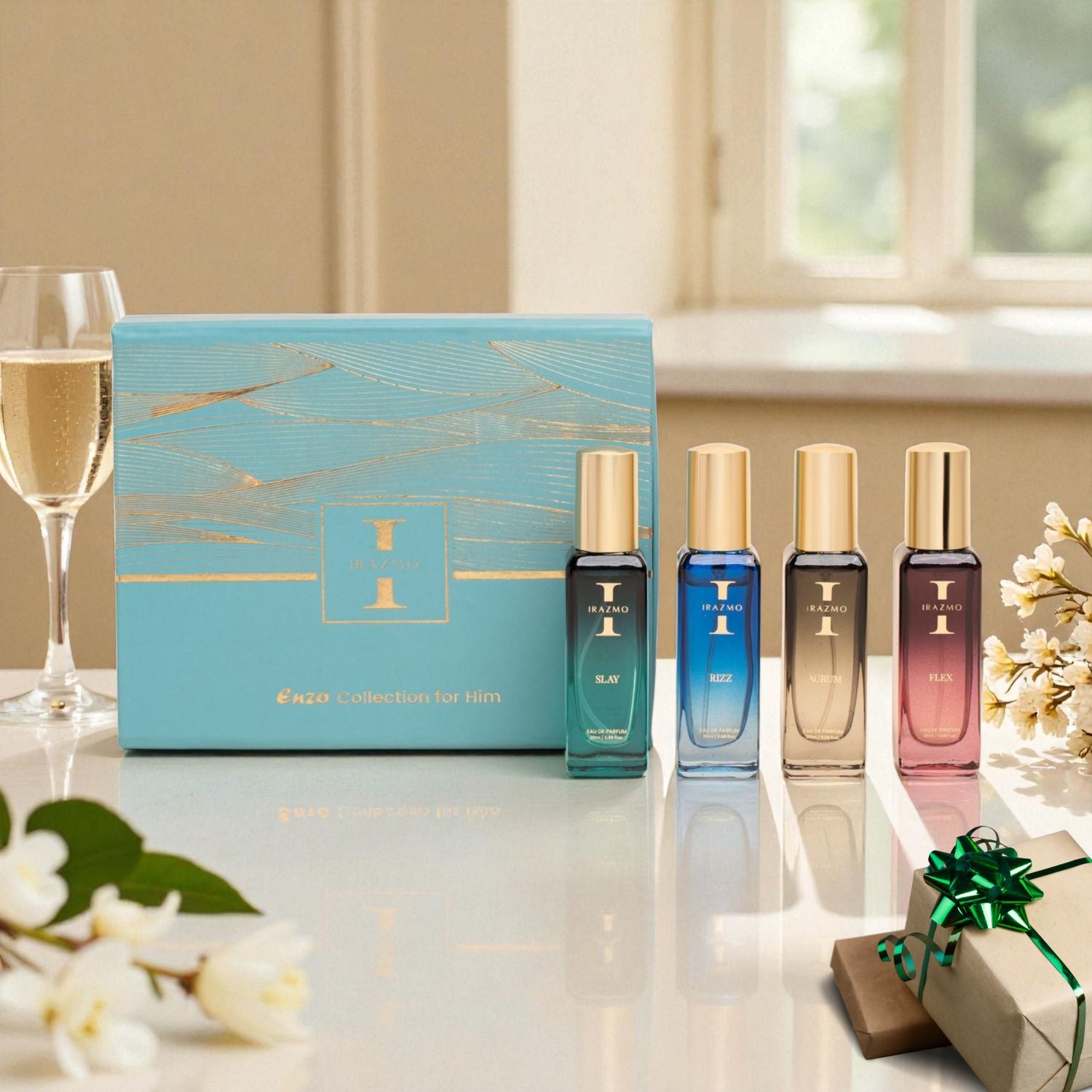 Set of perfume bottles with a decorative box on a table with flowers and a glass of wine.