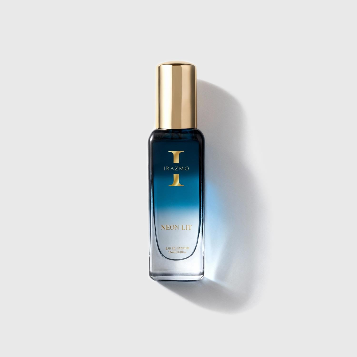 Perfume bottle with gold cap on a light gray background