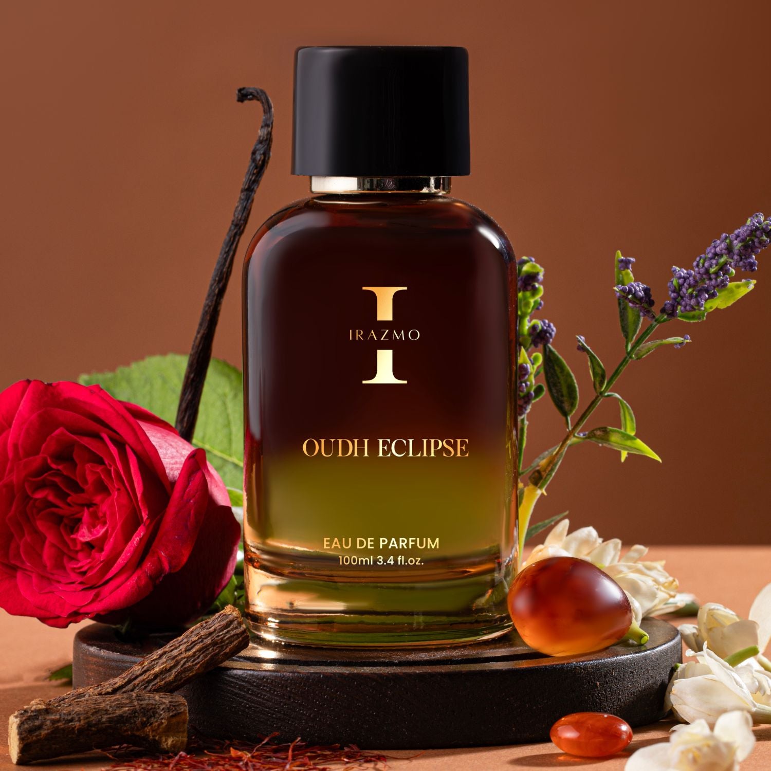 Irazmo Oudh Eclipse perfume bottle with flowers and spices on a brown background