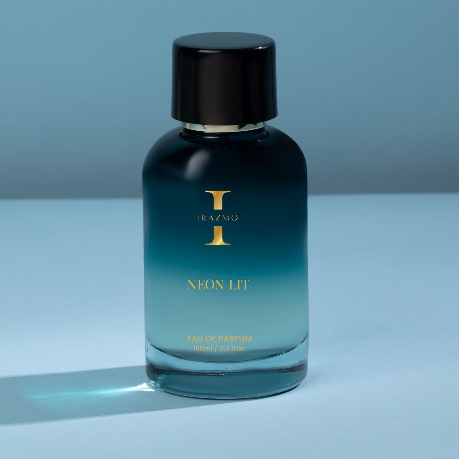 Perfume bottle with gradient design on a blue background