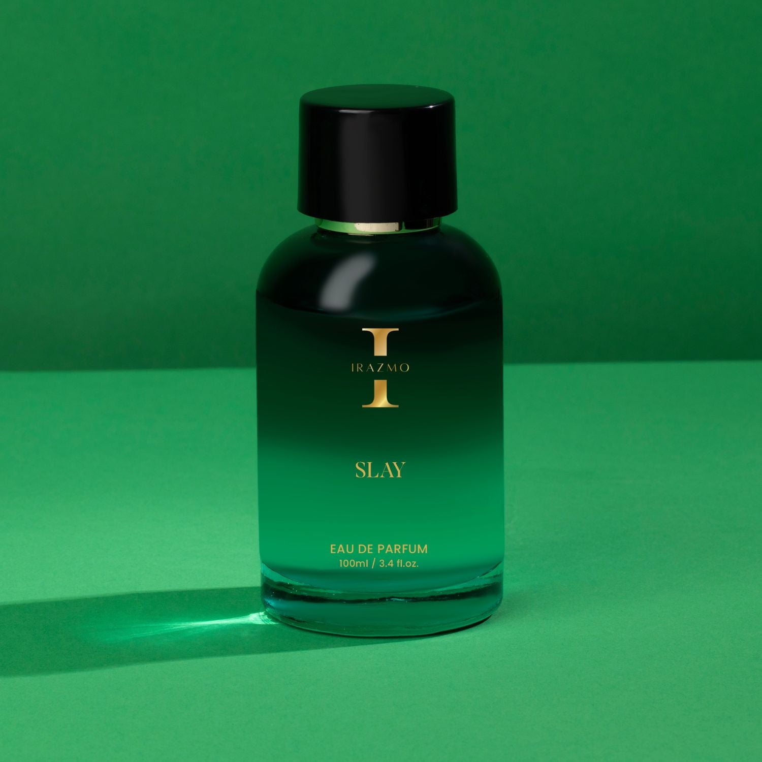 Green perfume bottle labeled 'SLAY' on a green background