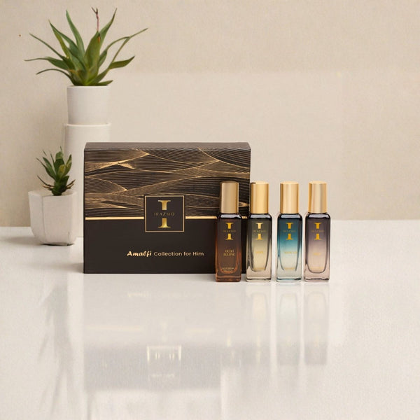 Amalfi Collection for Him perfume set with packaging on a reflective surface.
