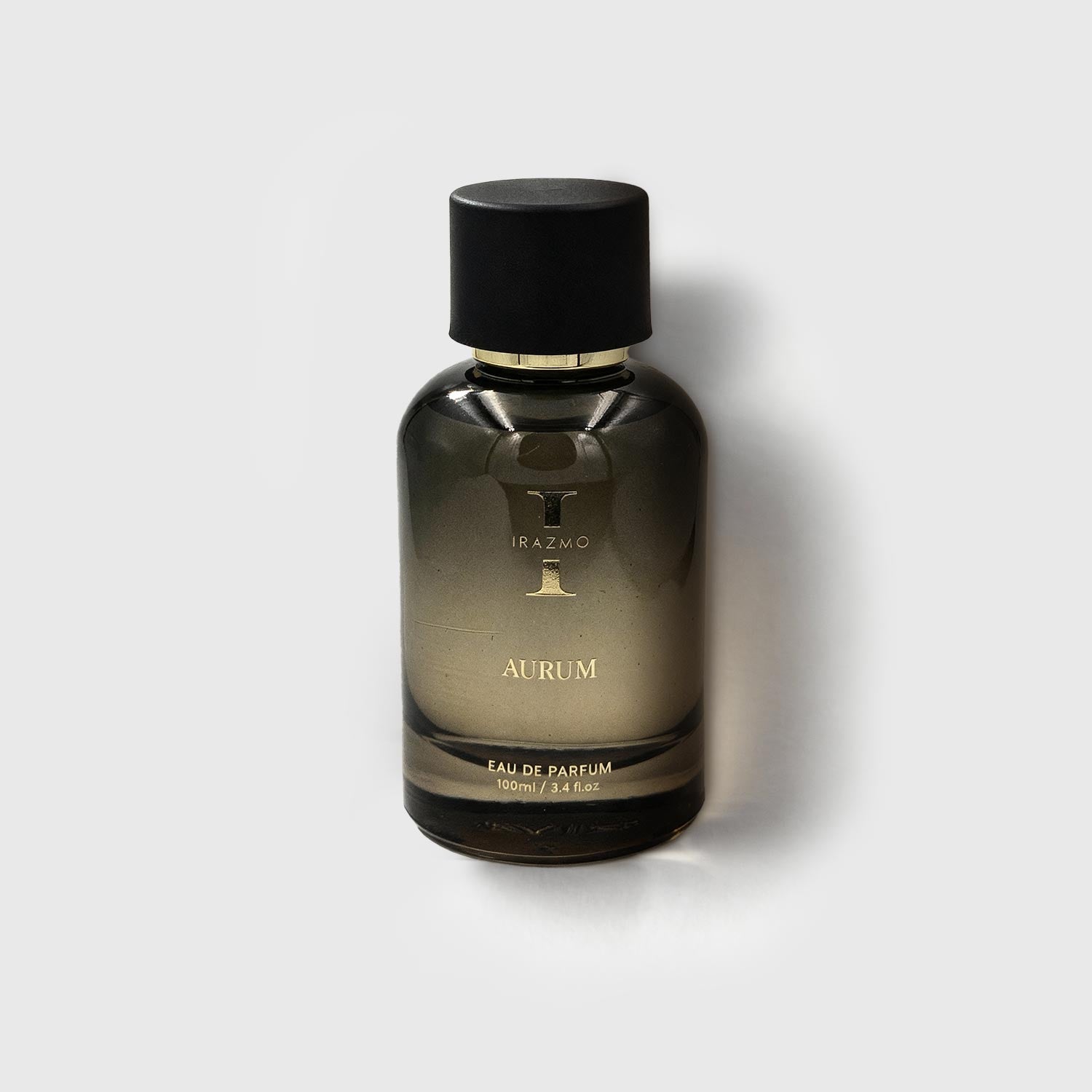 Perfume bottle labeled 'Aurum' by Tizano on a light gray background