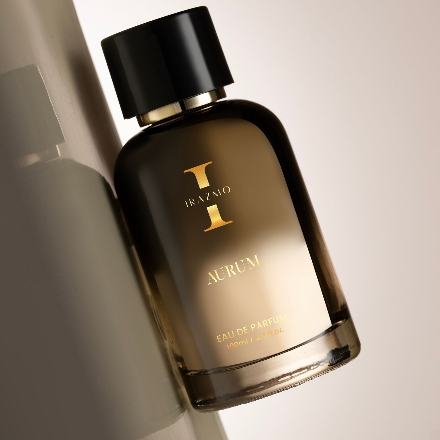 Perfume bottle labeled 'Irazmo I Aurum' on a neutral background
