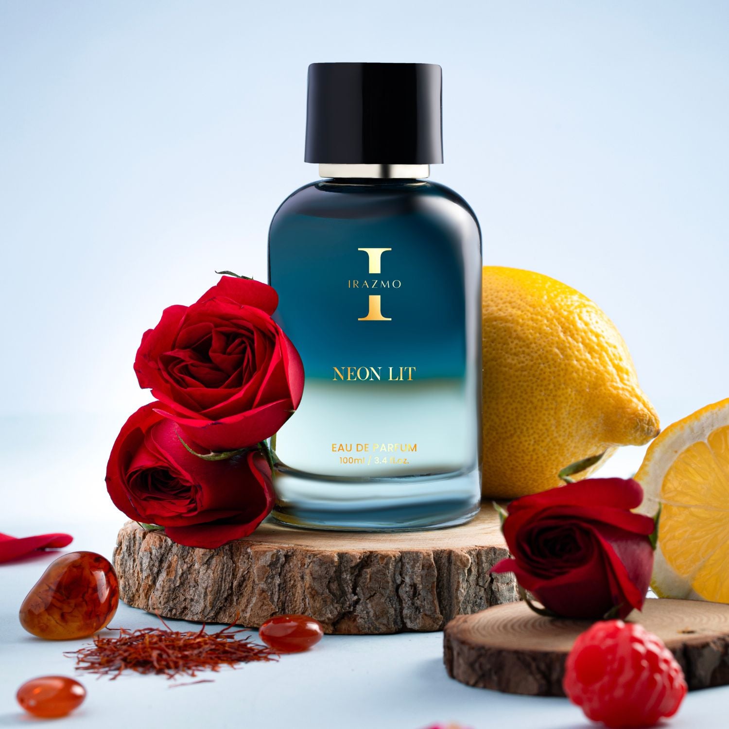 Perfume bottle labeled 'Neon Lit' with red roses and lemons on a wooden surface