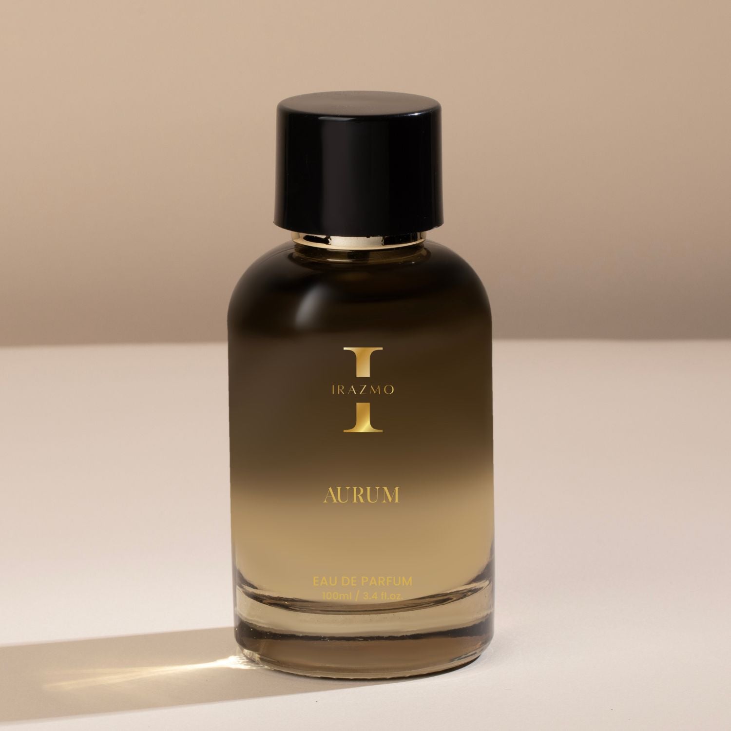 Perfume bottle labeled 'Irazmo Aurum' on a neutral background