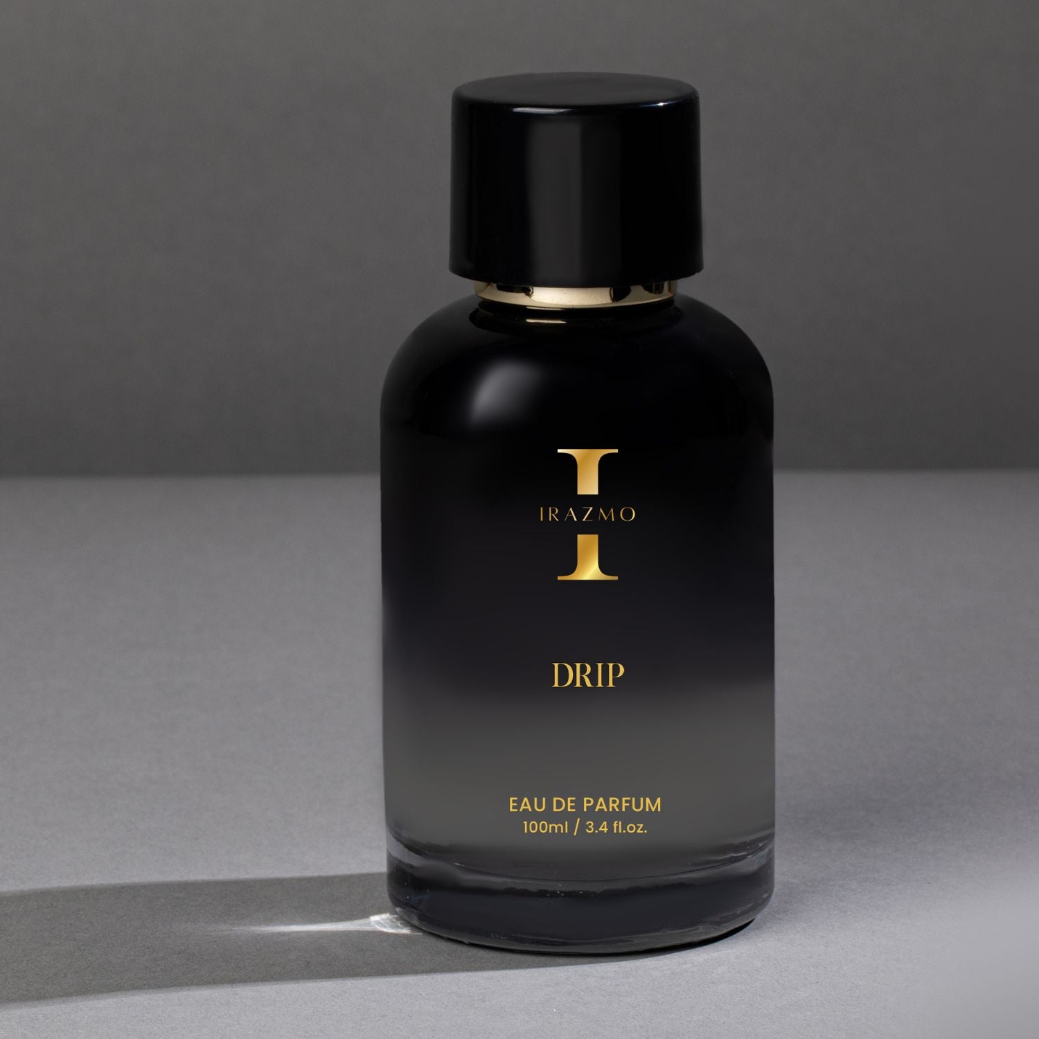Black perfume bottle labeled 'Irazmo Drip' on a gray background