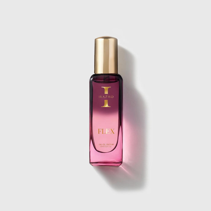 Pink perfume bottle with gold cap on a light gray background