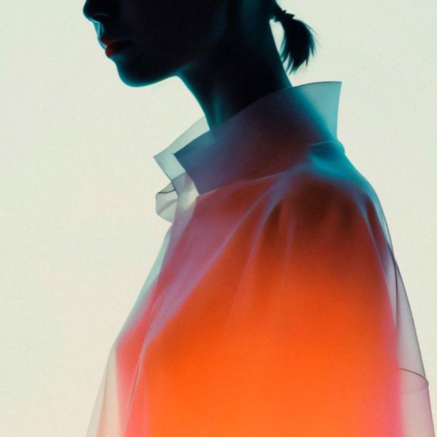 Silhouette of a person wearing a red and white outfit against a light background