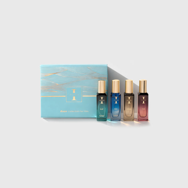 Set of four skincare bottles with a decorative box on a light gray background