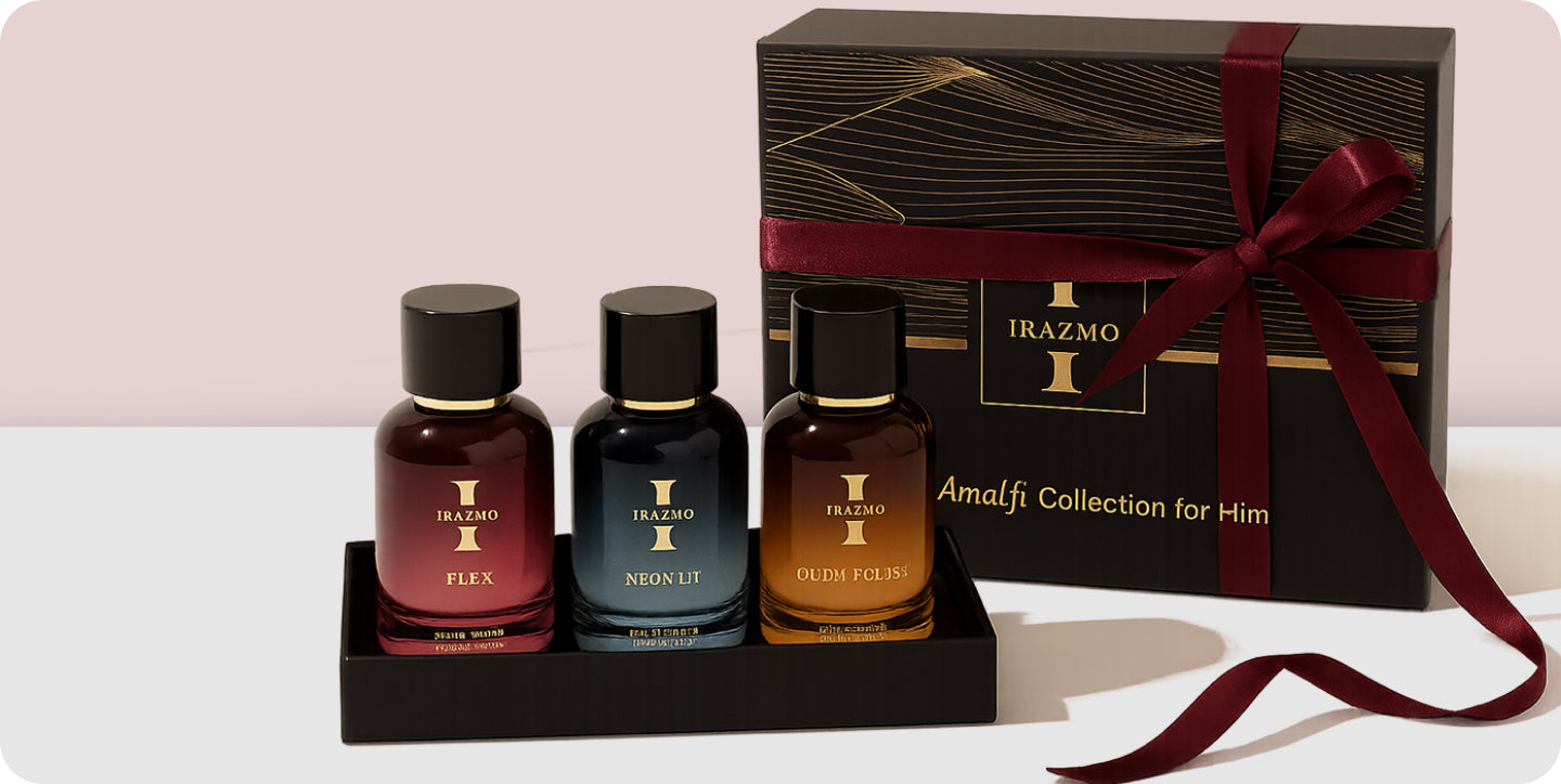 Three perfume bottles with a decorative box labeled 'Irazmo' on a light pink background