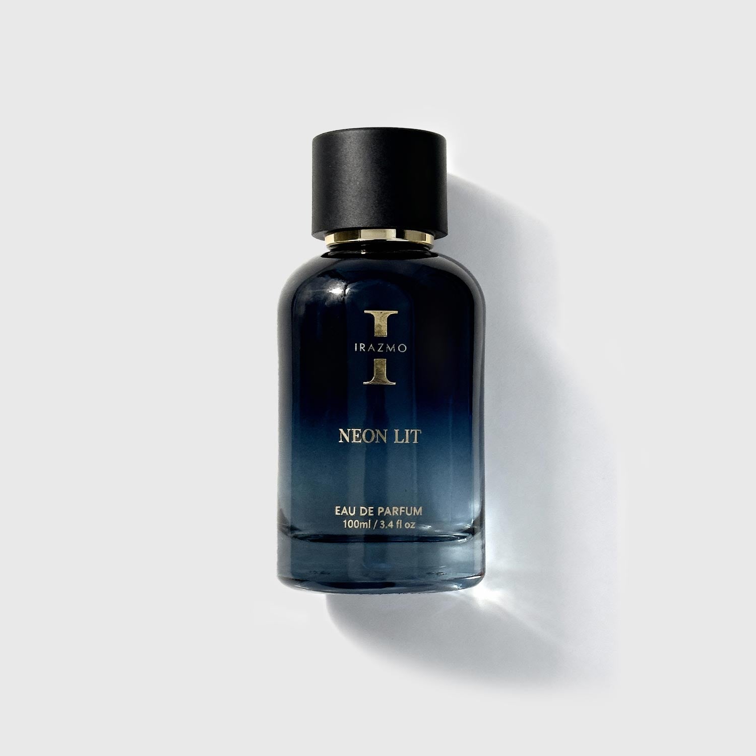Perfume bottle labeled 'Neon Lit' by Irazmo on a light gray background