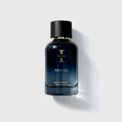 Perfume bottle labeled 'Neon Lit' by Irazmo on a light gray background