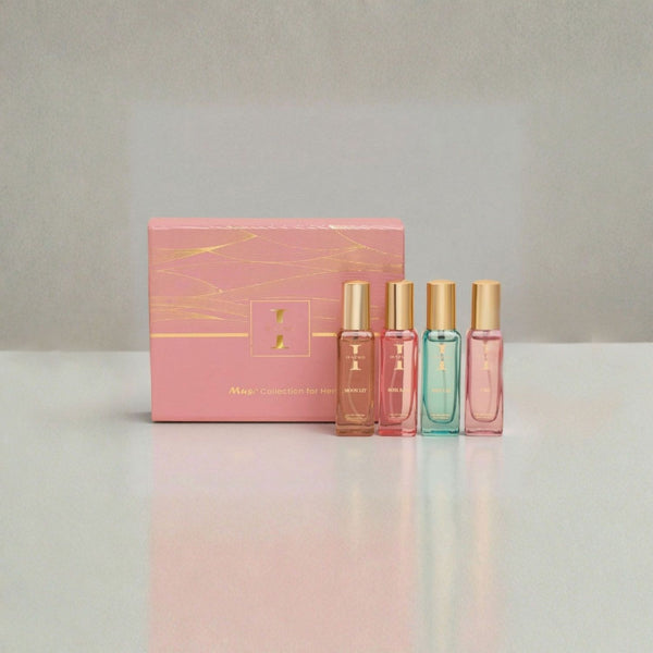 Set of four perfume bottles with a pink box on a gradient background